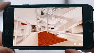 The interior of a building is displayed on a small screen