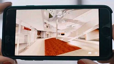 Das Interieur eines Gebäudes wir auf einem kleinen Bildschirm angezeigt