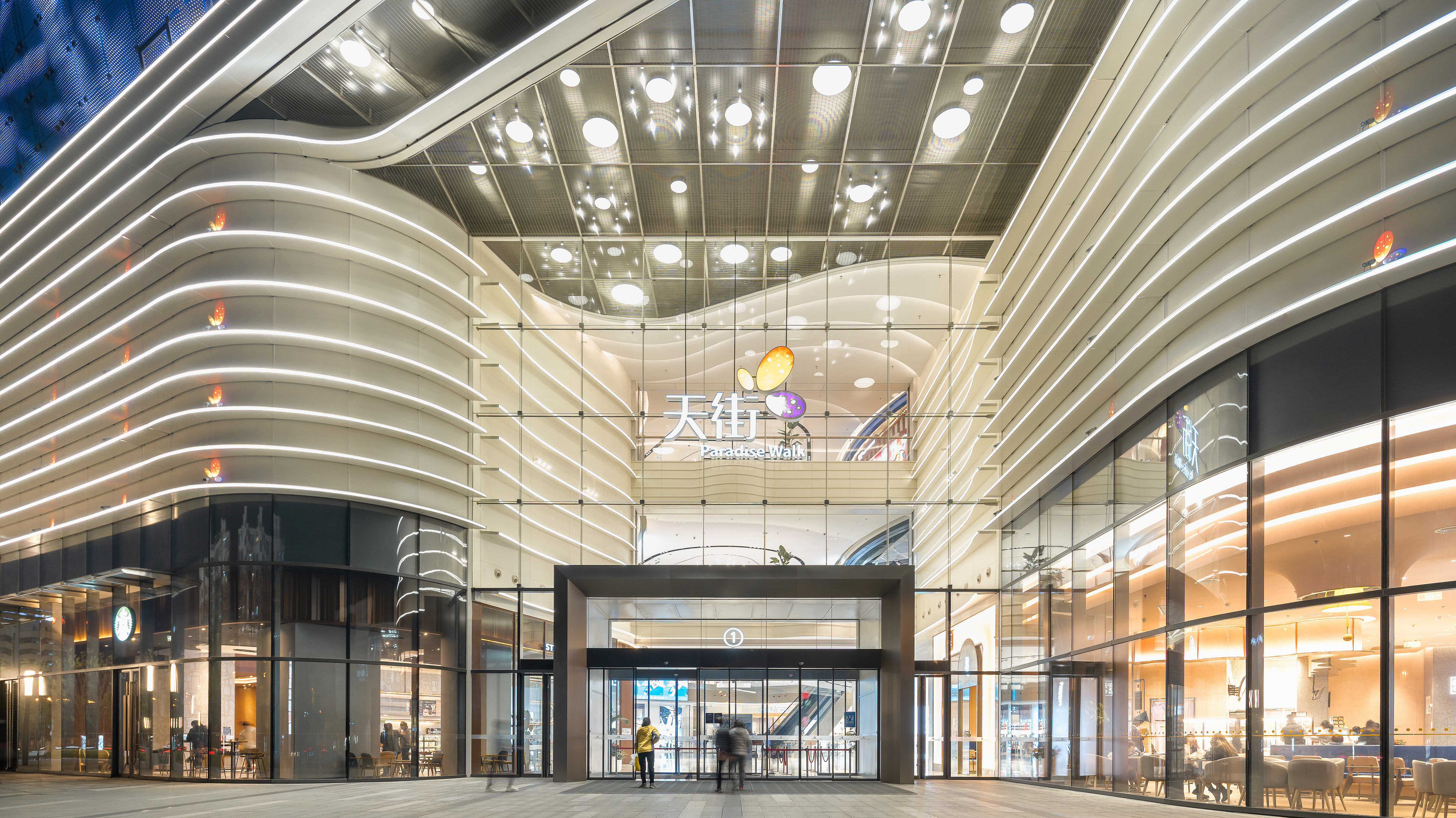 Elevation of the entrance to a shopping centre with curved architecture.