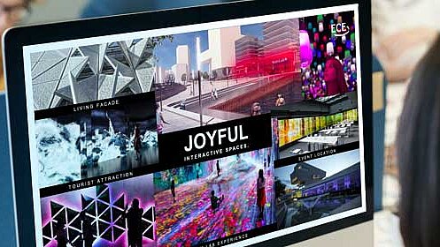 A logo and a design are displayed on a screen