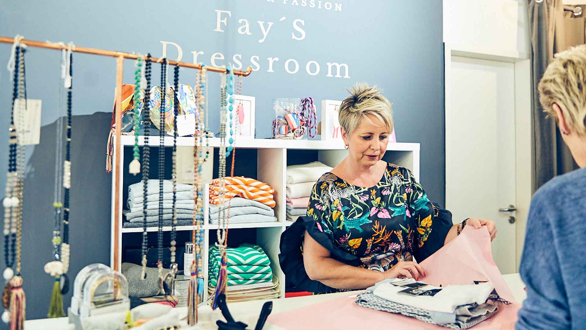 The owner of &quot;Fay&#039;s Dressroom&quot; serves a customer