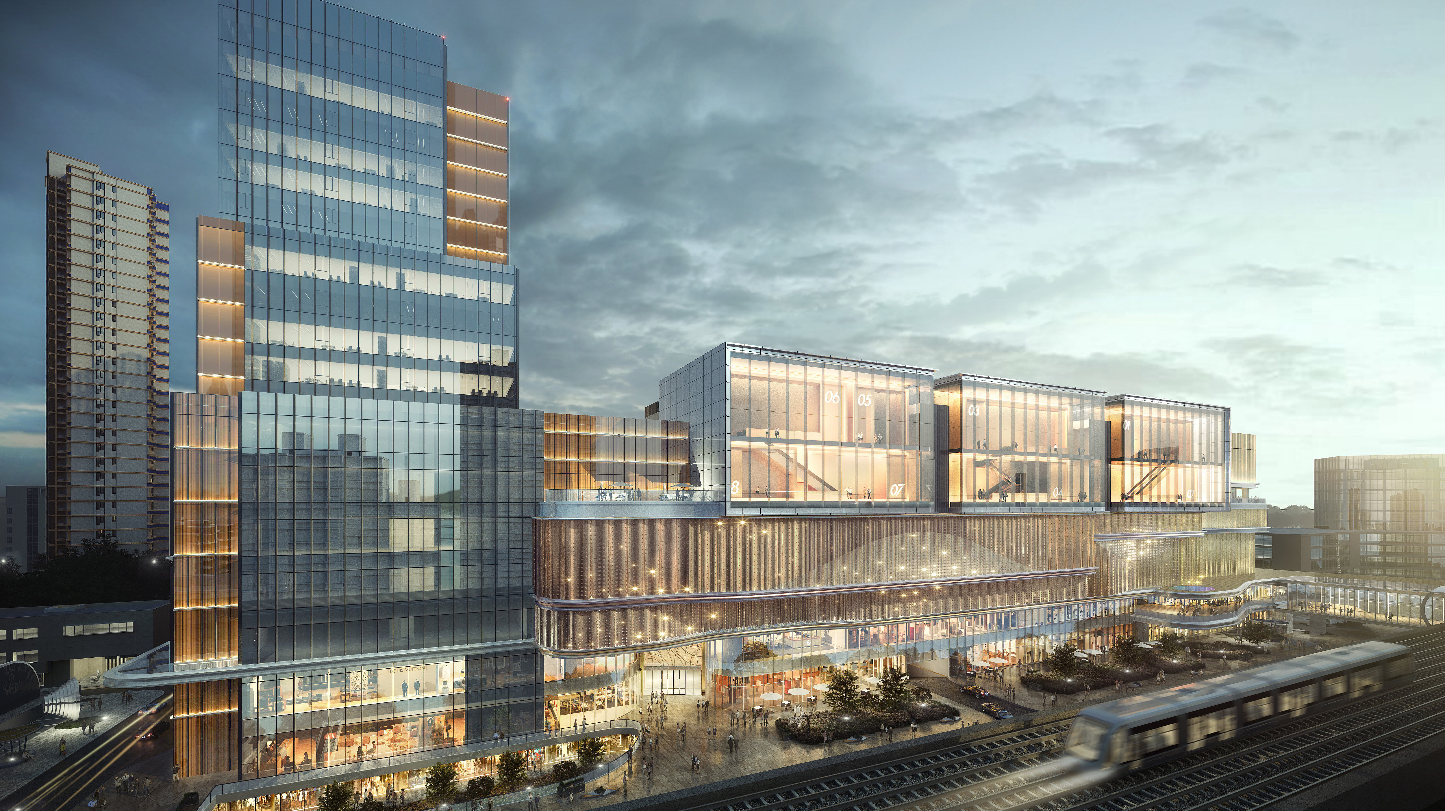 Ein Gebäude mit moderner Glasfassade, das in der Sonne glänzt.