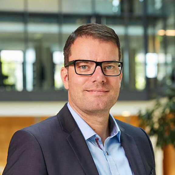 Portrait of Lukas Nemela looking friendly into the camera.