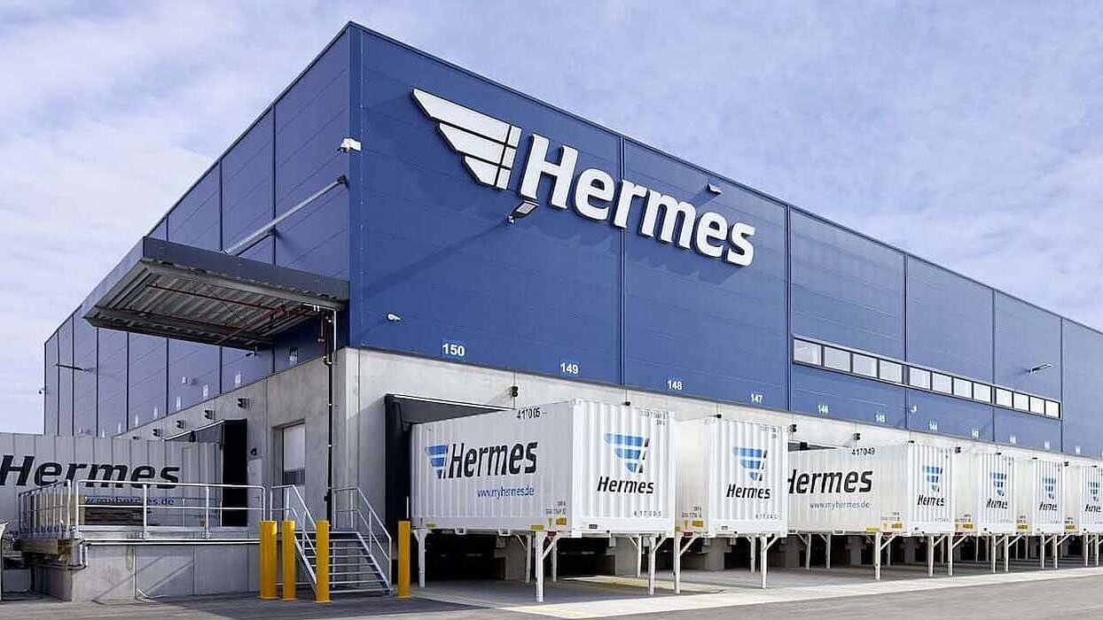View of the Hermes logistics centre with parked lorry containers.
