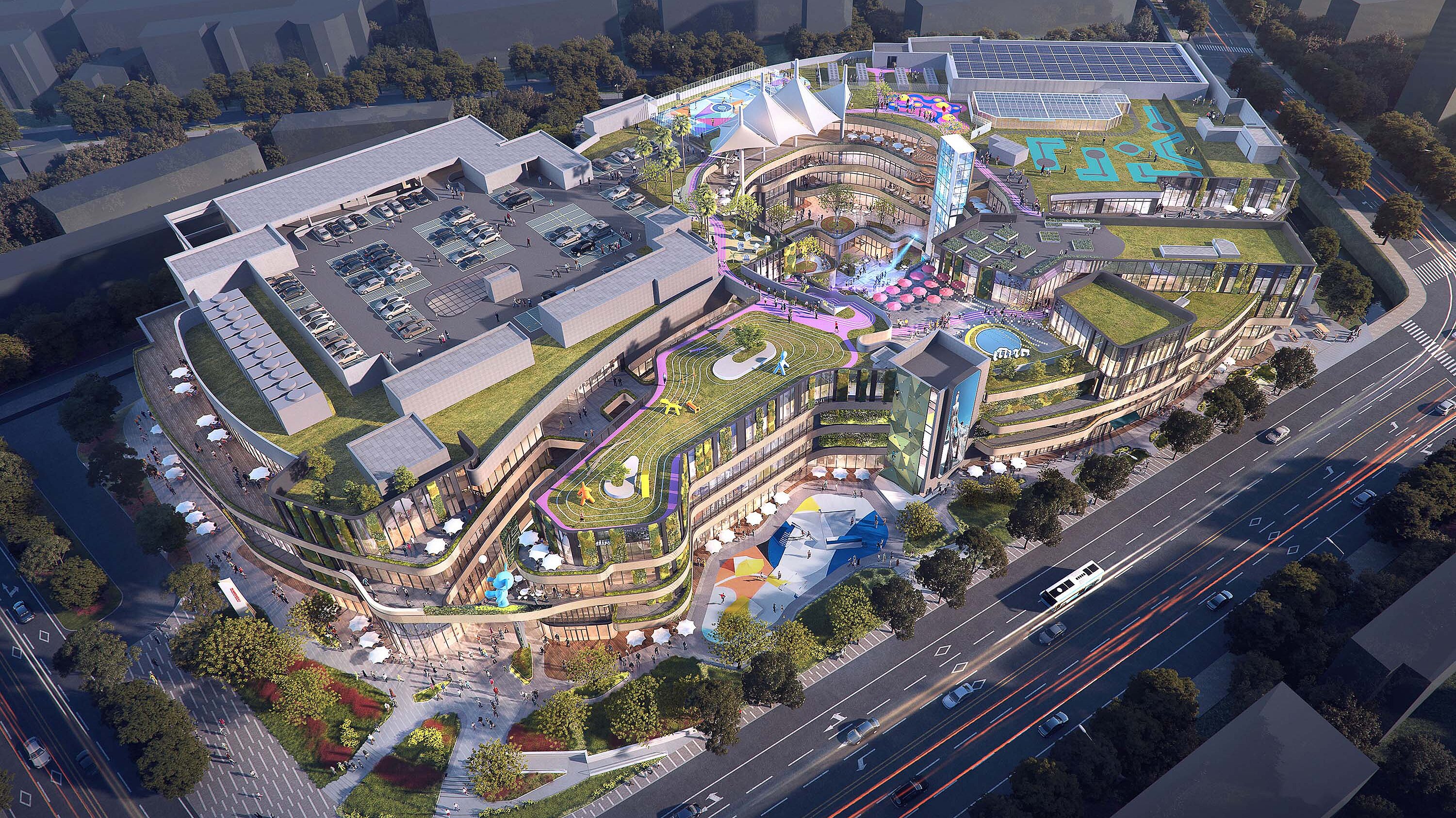 Vogelperspektive auf ein riesiges Gebäude mit Grünflächen und weiteren Ausstattungen.