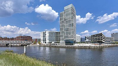 The modern, architecturally special &quot;Freeport&quot; building in Hamburg is surrounded by water.