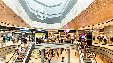 The internal elevation of a busy shopping centre.
